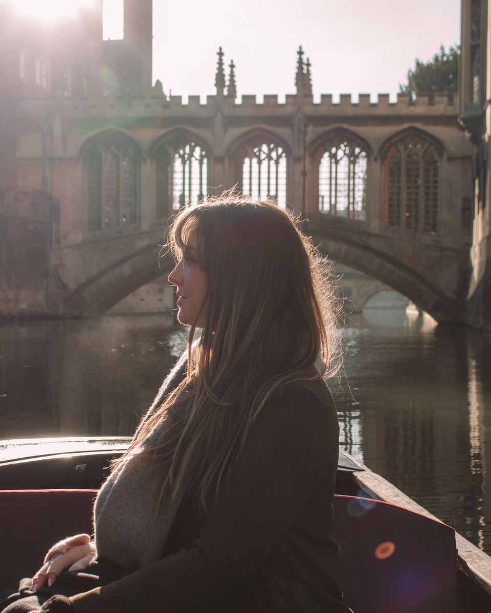 Elise on a punt in Cambridge in front of the Bridge of Sighs